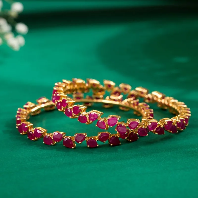 Gold bangles with rubies studed